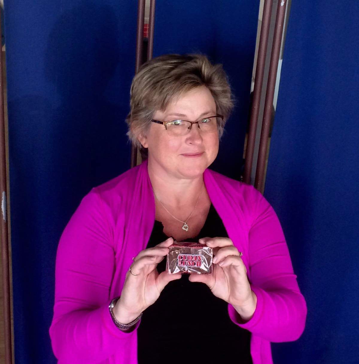Crystal Regehr Westergard holds a Cuban Lunch, a rectangular peanut-and-chocolate confection, in this undated handout photo. Every time Crystal Regehr Westergard would go out shopping as a youth, she would ask her mother if she wanted anything. There was only ever one request: Cuban Lunch. 