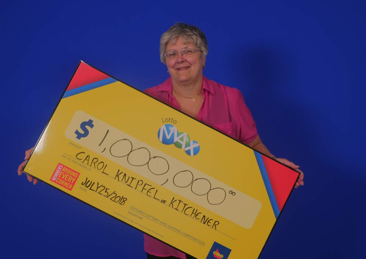 Carol Knipfel collects her prize.