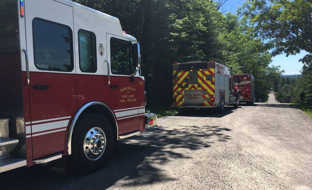Firefighters are responding to reports of a man trapped after a concrete wall collapsed at a home north of Port Hope.