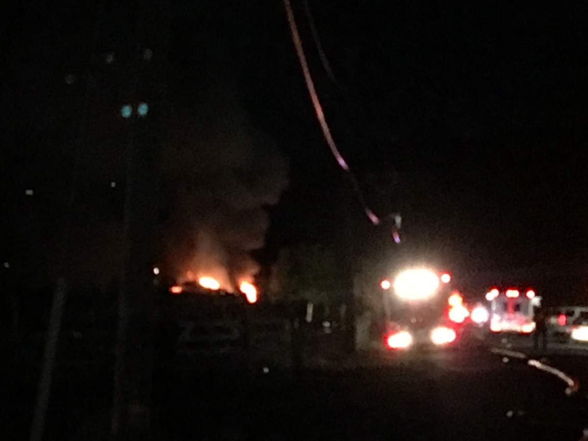 Emergency personnel on the scene of a devastating house fire in West Kelowna on July 4, 2018.