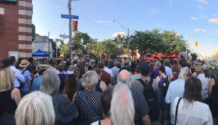 Hundreds of residents attend a vigil for the victims of the Danforth shooting.