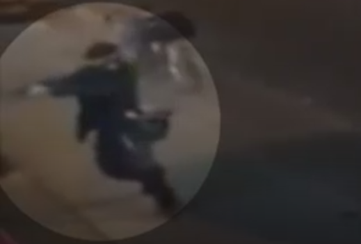 Screengrab from a video that shows a shooter pointing and firing a gun on Danforth Avenue in Toronto on July 22, 2018.