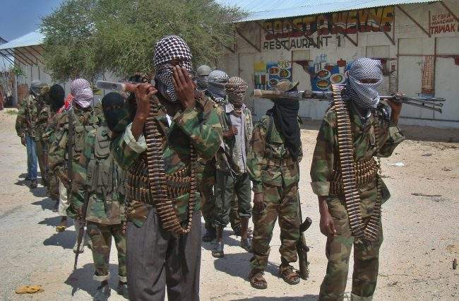 Al-Shabab recruits walk down a street in the Somali capital Mogadishu on March 5, 2012 following their "graduation" ceremony.