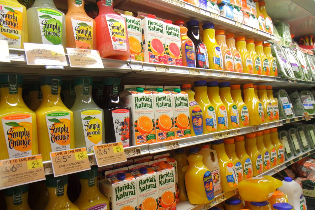 Shelves of orange juice at Publix, grocery store.
