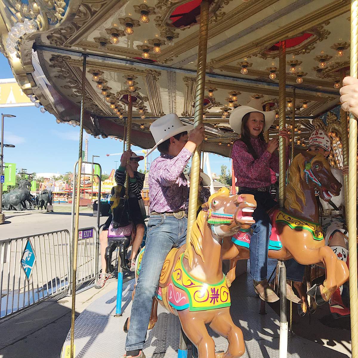 Taryn LaBrie rides the carousel with her brother Dalton