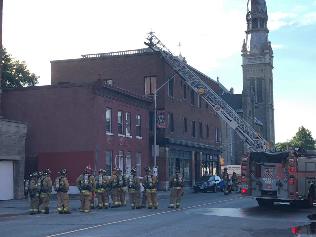 Between 60 and 70 firefighters responded to a three-alarm fire that originated on the rooftop deck of a three-storey building in the ByWard Market on Monday evening.