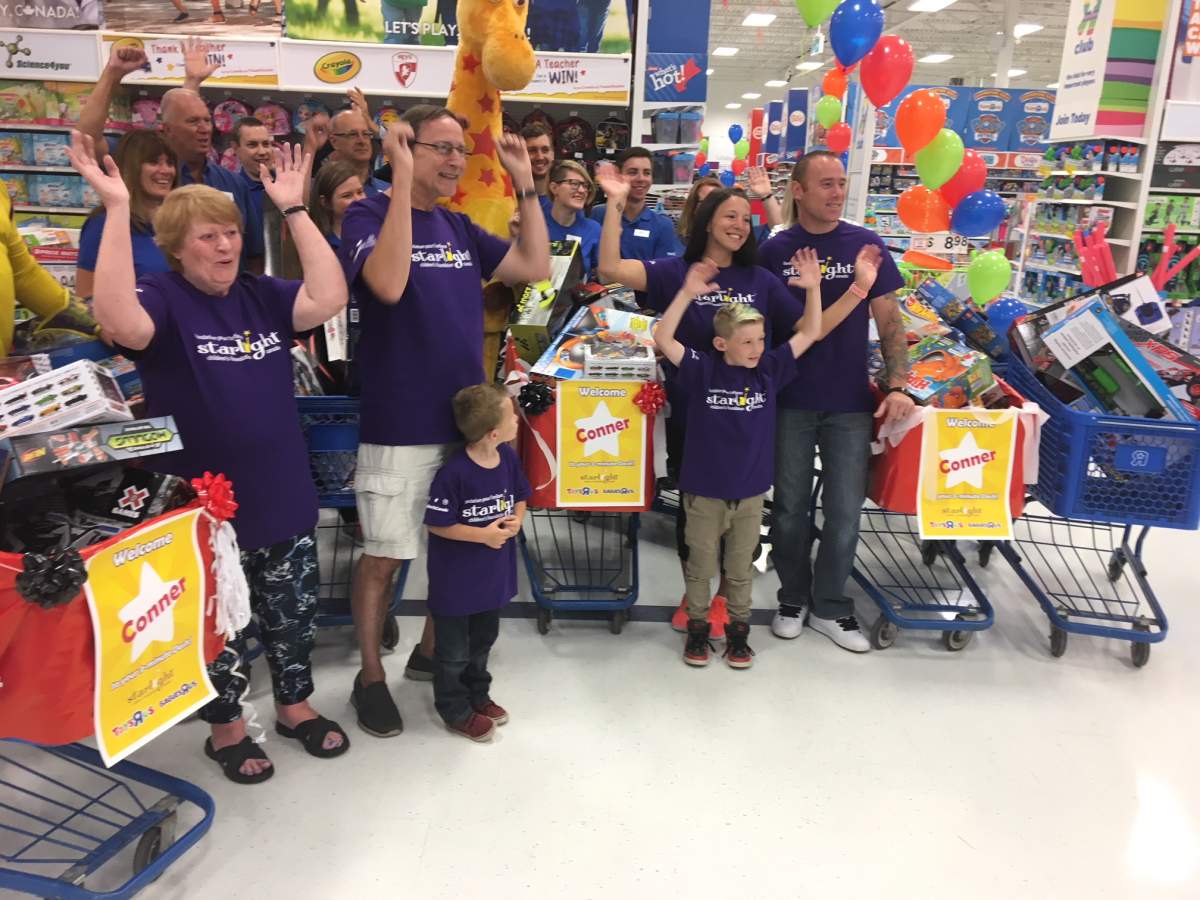 Conner, with family and friends during his toy dash in Winnipeg Tuesday.