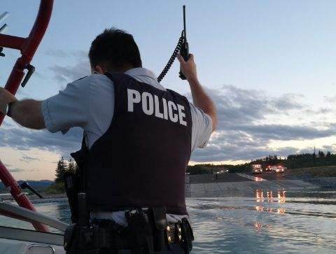 An RCMP member and a Good Samaritan with a boat worked together Saturday night to help rescue 10 people whose boat had sunk in Ghost Lake, located west of Calgary. July 14, 2018.