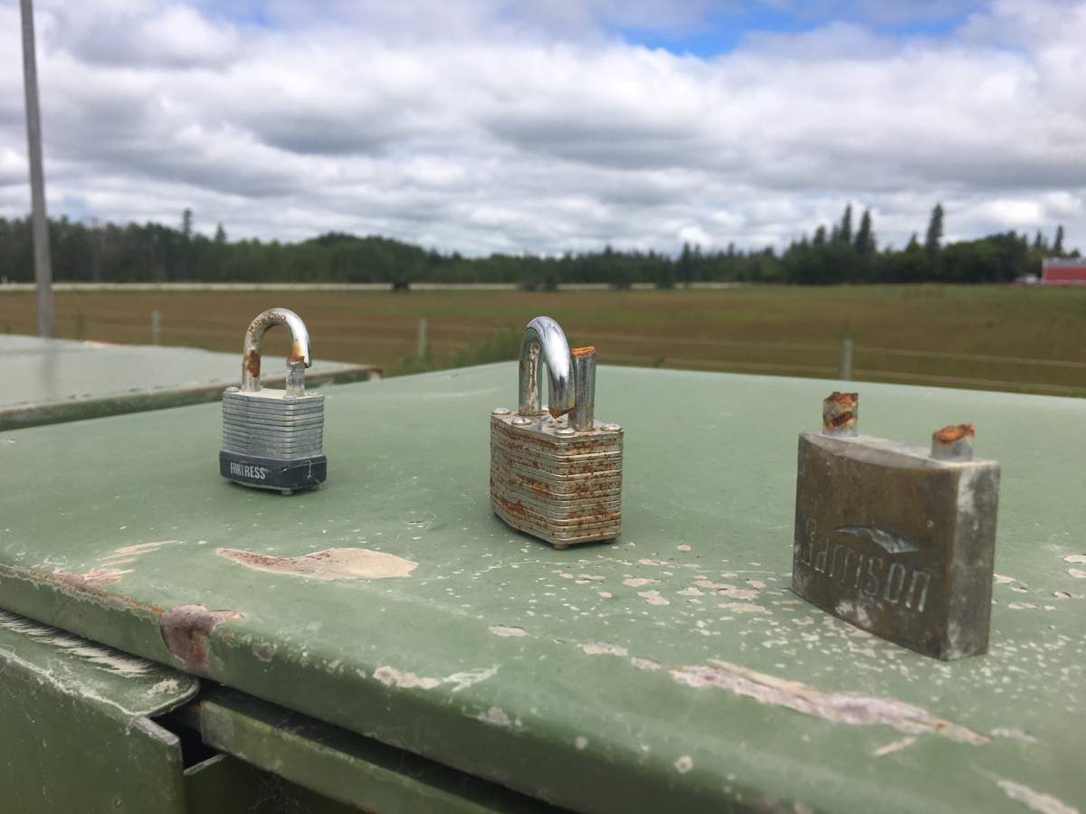 Three broken locks sit on top of this community mailbox in the RM of Springfield.