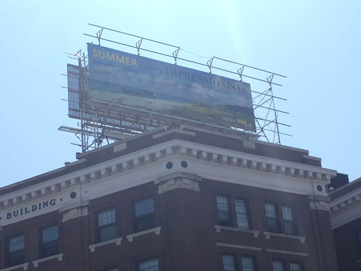 A graffiti-covered, vacant billboard at Portage Avenue and Sherbrook Street has finally gotten a makeover.