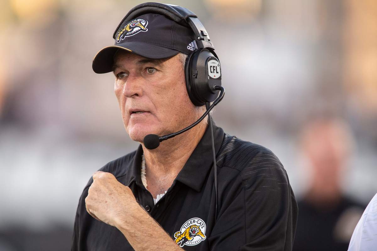 Hamilton Ticats head coach June Jones watches his team take on the Saskatchewan Roughriders on Thursday, July 5, 2018.