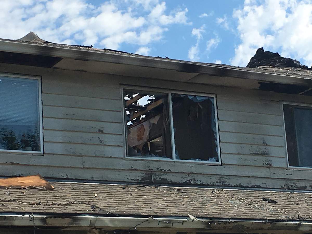 A closer look at the damaged roof and second storey of the fire-damaged roof on Turner Road.