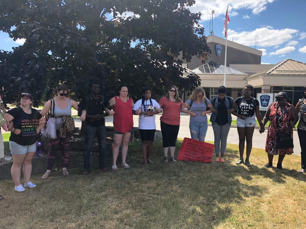 Friends and family of Brown gather outside of the Barrie Police Service station in peaceful protest.