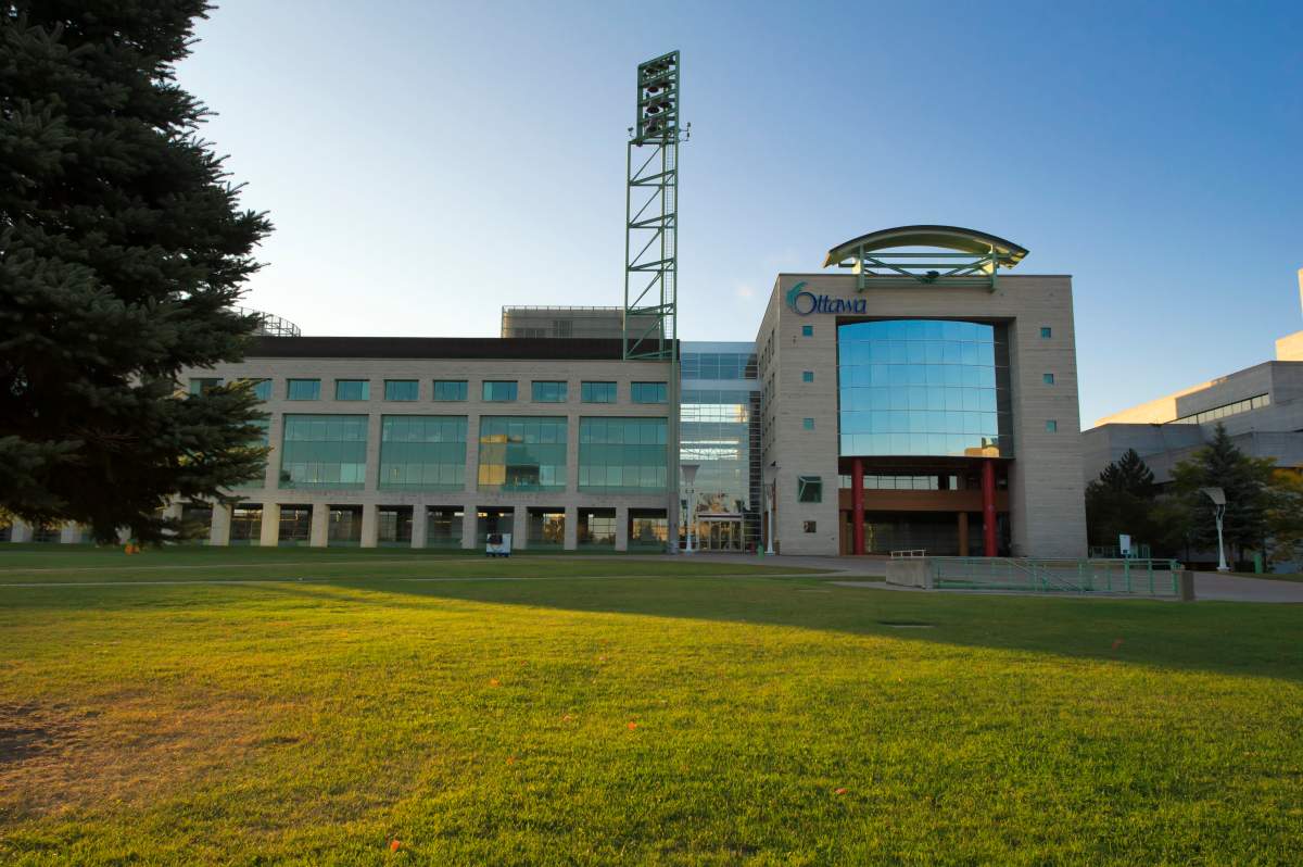 The modern section of Ottawa City Hall is seen at dusk from Laurier Avenue.