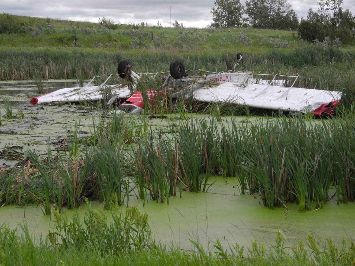 A plane flipped into a boggy area near Russel, Man. on Wednesday, July 4, 2018.