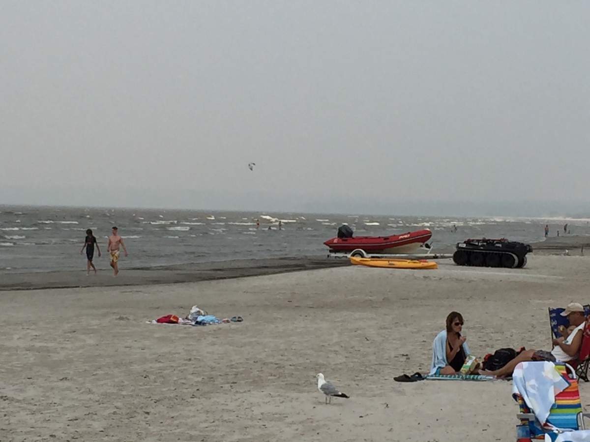 Smoke from fires could be smelled and seen along north Grand Beach Friday afternoon.
