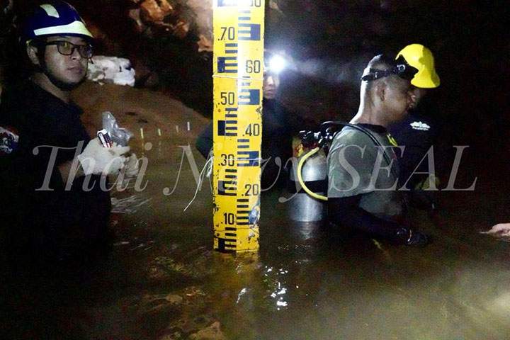Rescue personnel work at the Tham Luang cave complex, as members of an under-16 soccer team and their coach have been found alive, in the northern province of Chiang Rai, Thailand July 4, 2018.