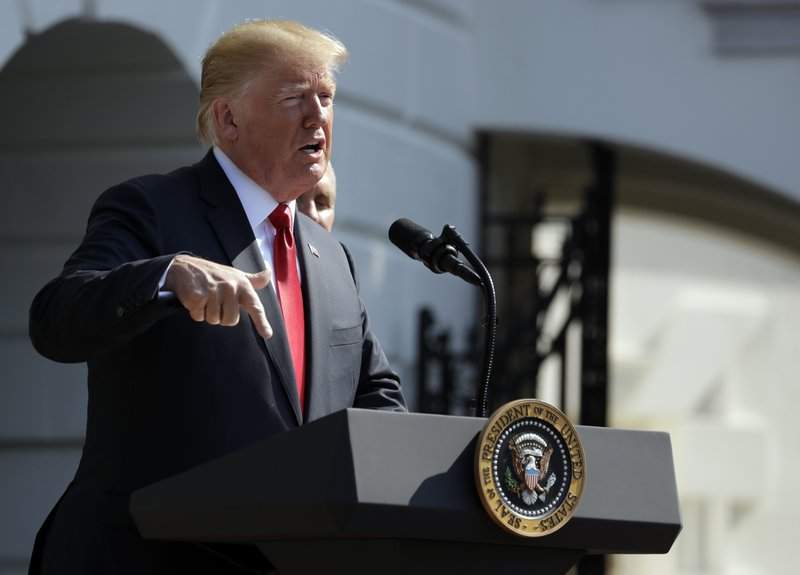 In thisJKuly 27, 2018, photo, President Donald Trump speaks about the economy at the White House in Washington.