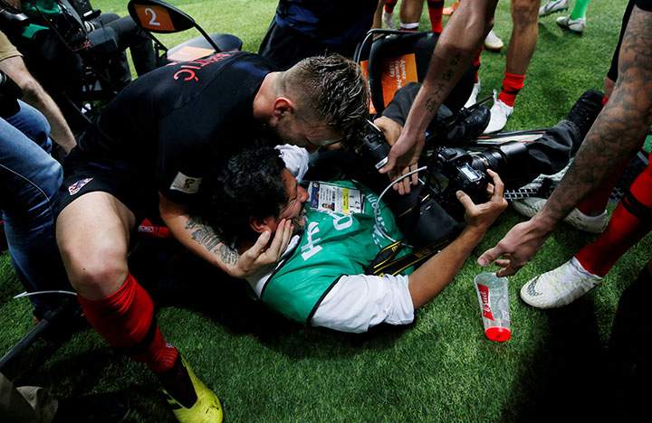 Croatia’s Ivan Rakitic celebrates with an AFP photographer Yuri Cortez after Mario Mandzukic scores their second goal.