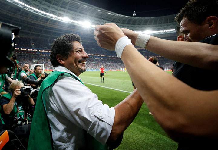Croatia’s Mario Mandzukic celebrates next to an AFP photographer Yuri Cortez after scoring their second goal.