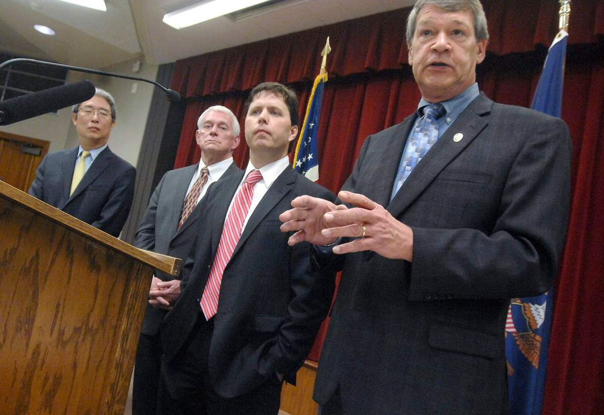 North Dakota Attorney General Wayne Stenehjem, right, answers questions during a news conference after the announcement of the formation of the Bakken Organized Crime Strike Force, Wednesday, June 3, 2015, at the State Capitol in Bismarck, N.D. Also at the announcement were, from left, Bruce Ohr, with the U.S. Department of Justice, Montana U.S. Attorney Mike Cotter and acting North Dakota U.S. Attorney Chris Myers.