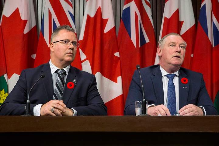 President of the Police Association of Ontario Bruce Chapman (right) and President of the Ontario Provincial Police Association Rob Jamieson attend a news conference at the Queens Park Legislature in Toronto on Thursday Nov. 2, 2017. 