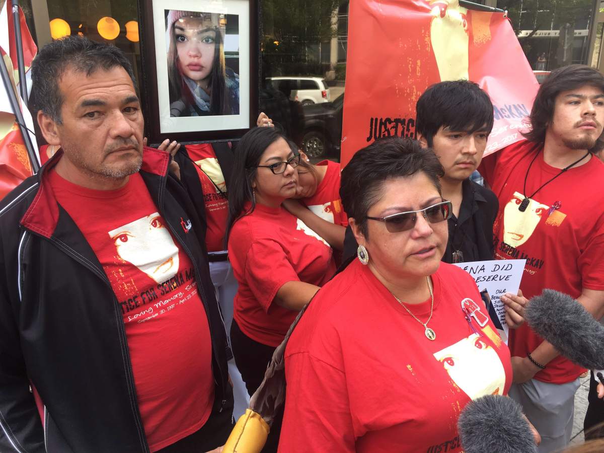 Roland Mousseau (left) and Delores Daniels (middle-right) speak to reporters after a youth was sentenced in the beating death of Daniels' daughter, Serena McKay, on the Sagkeeng First nation, in Winnipeg on Thursday, August 2, 2018. Mousseau, who was the victim's stepfather, erupted in court and shouted that the youth sentence given out Thursday was not nearly enough. 