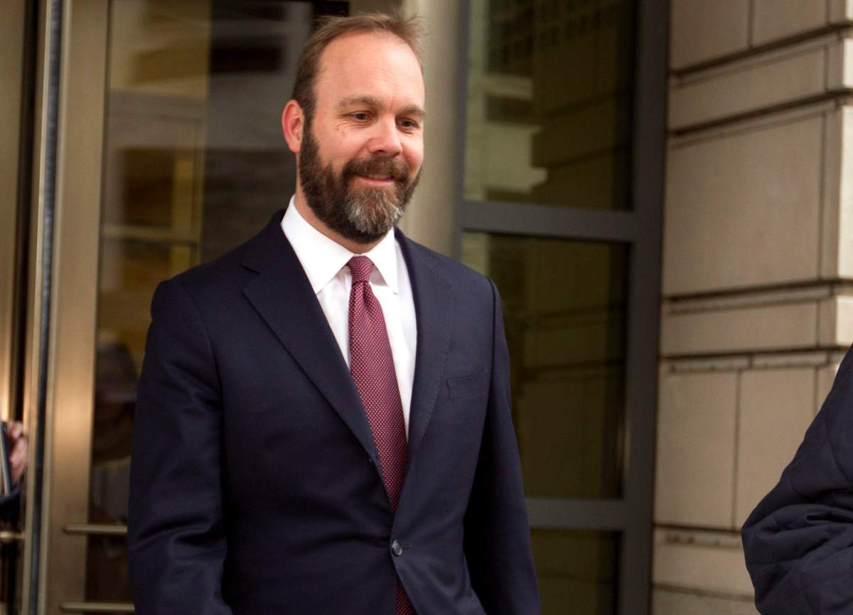 FILE – In this Feb. 23, 2018, file photo, Rick Gates leaves federal court in Washington. 