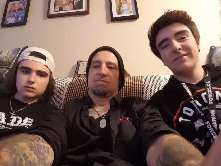 Donnie Robichaud, centre, poses with his sons Draiden and Zakkery in this family handout photo.