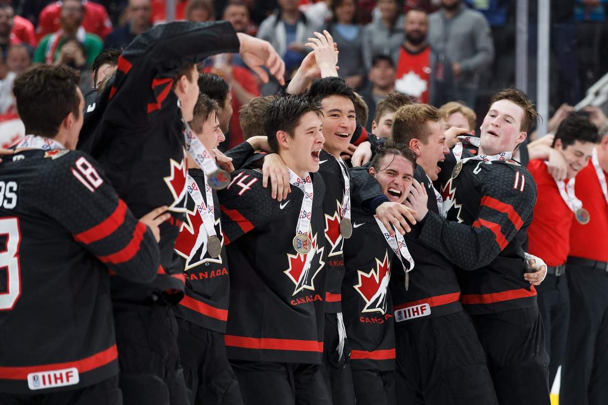 Canada celebrates their victory over Sweden following the Hlinka Gretzky Cup gold medal game in Edmonton on Saturday.