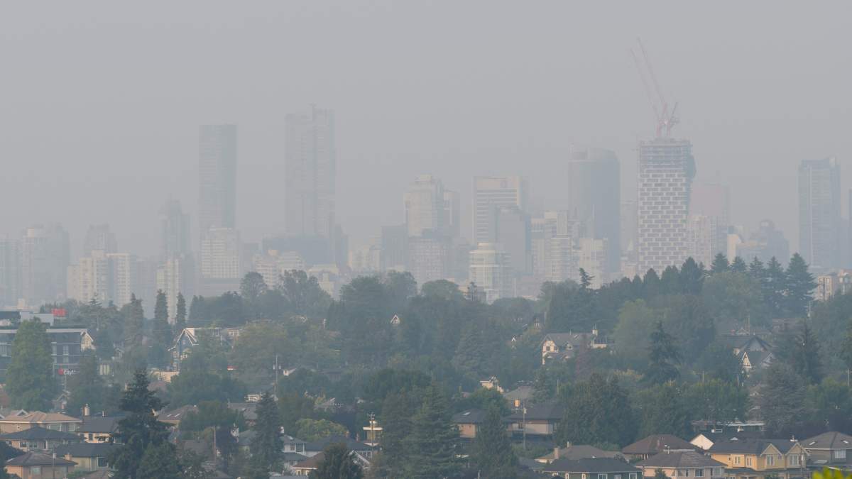 Smoke from distant wildfires obscures the view as a heavy haze blankets the city of Vancouver, B.C. on Tuesday, August 14, 2018.