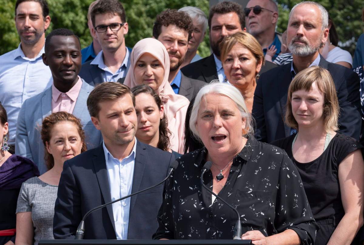 Québec Solidaire Manon Massé, flanked by co-spokesperson Gabriel Nadeau-Dubois and local candidates, addresses supporters as they launch their campaign in Montreal on Thursday, August 23, 2018. Quebecers will go to the poll Oct. 1. 