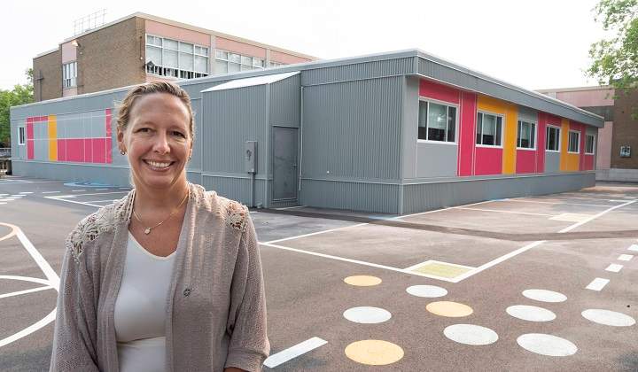 Marie-José Mastromonaco, vice-president of the Montreal School Board, is seen next to temporary classrooms at the Saint-Gabriel-Lalemant in Montreal on Friday, August 24, 2018. 