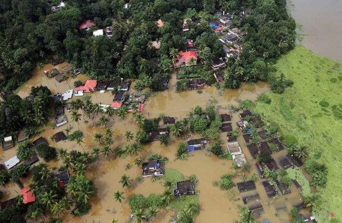 An aerial view shows partially submerged houses at a flooded area in the southern state of Kerala, India, August 17, 2018.