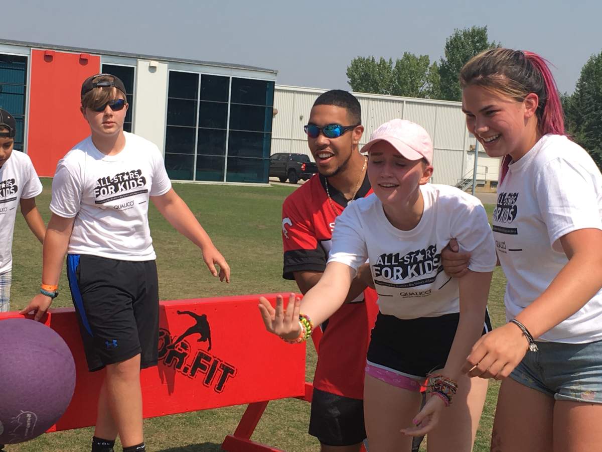 Calgary Stampeders receiver Reggie Begelton mentoring kids with Big Brothers Big Sisters at Winsport in Calgary. Aug. 8th 2018.