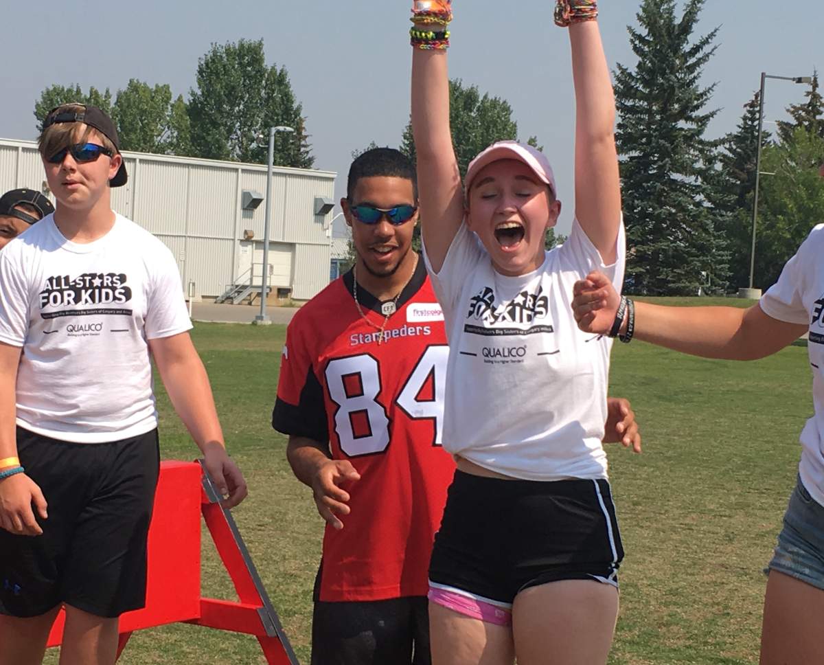 Ceira Stephenson having fun with Calgary Stampeders receiver Reggie Begelton at Winsport in Calgary. Aug. 9th, 2018.