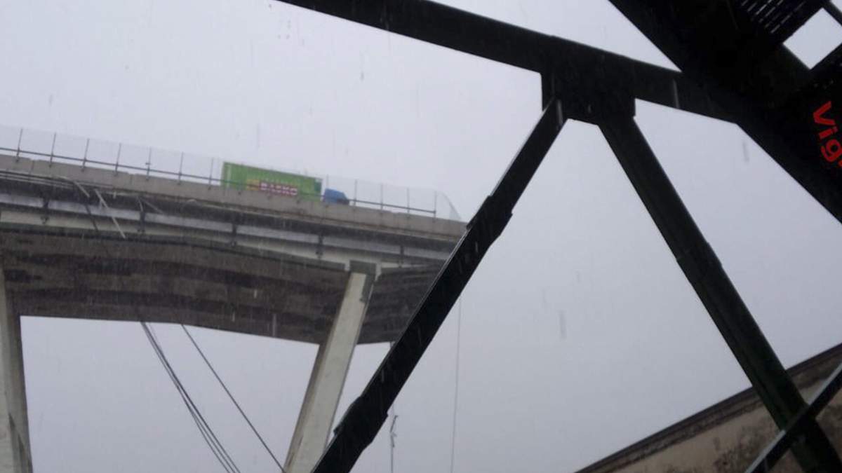 This photo released by the Italian firefighters, shows a truck stopped where the Morandi highway bridge collapsed in Genoa, Tuesday, Aug. 14, 2018.