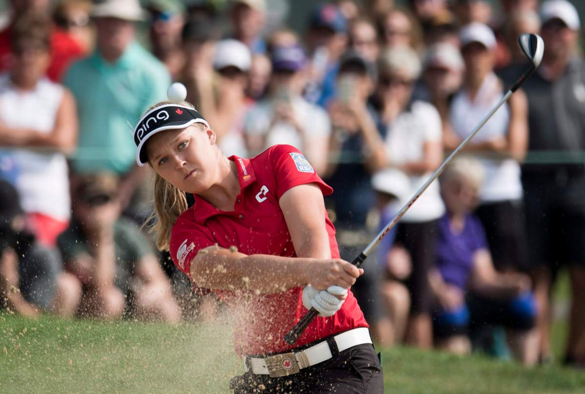 Brooke Henderson, of Smiths Falls, Ont., takes a shot out of the sand trap on the 17th green during the CP Women's Open in Regina, Friday, August, 24, 2018.