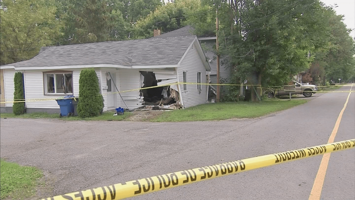 A car crashed through a home in Léry, Que., leaving a gaping hole in the building. Tuesday, Aug. 14, 2018.