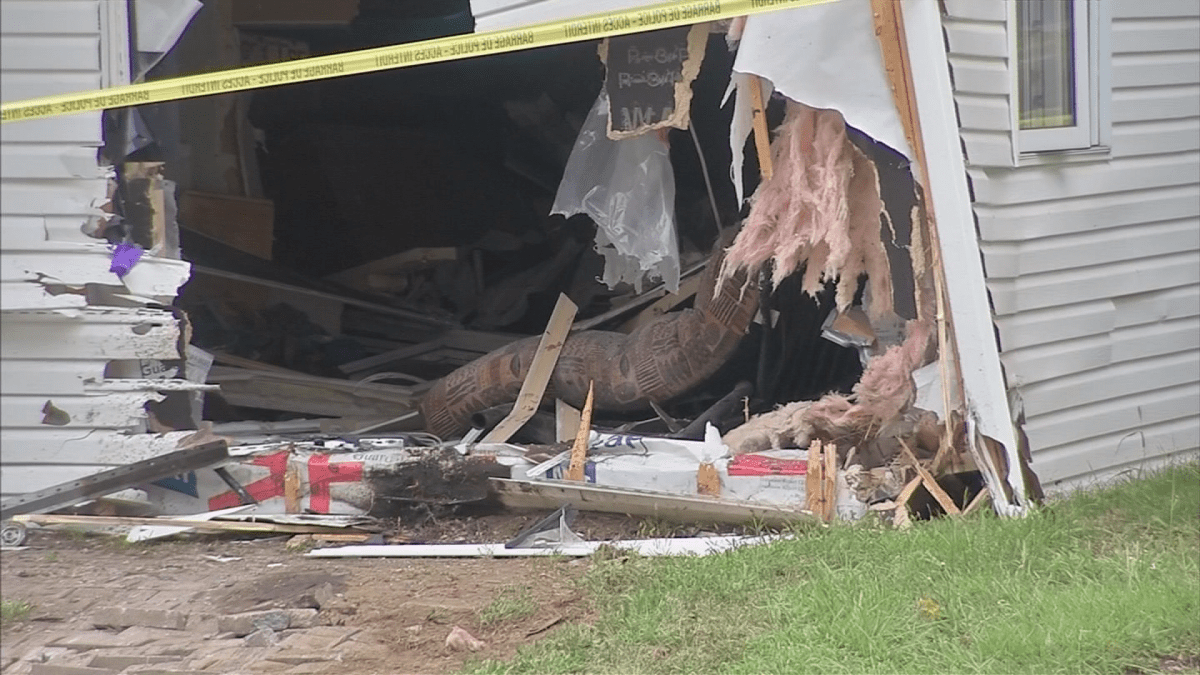 A gaping hole is left where a car crashed through the house. Tuesday, Aug. 14, 2018. Photo TVA