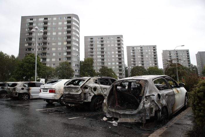 Burned out cars at Frolunda Square in Gothenburg, Sweden, 14 August 2018.