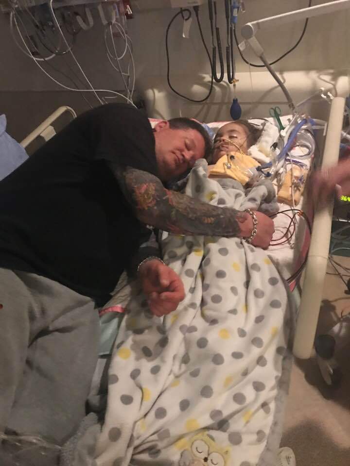 Craig Morrison lays in a hospital bed with his daughter Brielle. Morrison died in hospital on August 6, 2018.