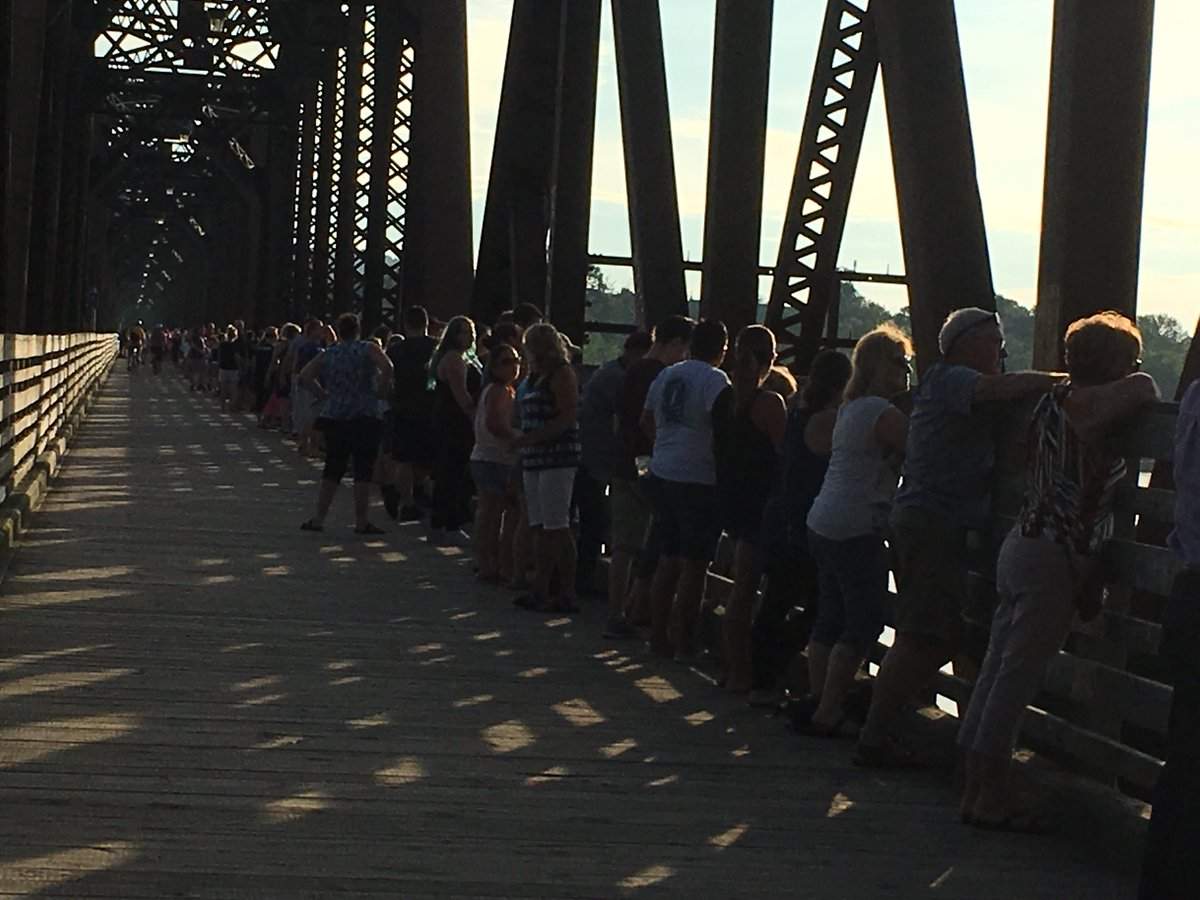 Tributes to the victims continued Monday evening as thousands of people turned out to express their grief, hold hands and show support for their city.