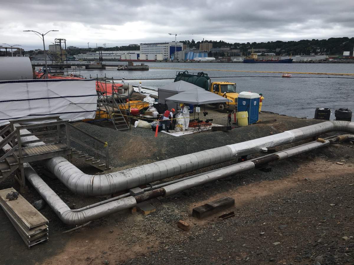 Twelve days after the oil leak at the Tufts Cove power plant in Halifax, N.S., workers continue to work on the cleanup. 