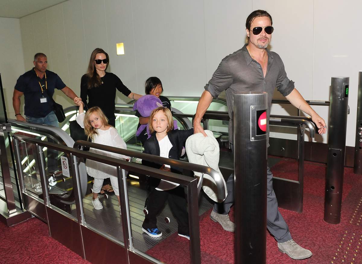 Brad Pitt, Angelina Jolie and their children Pax, Knox and Vivienne arrive at Tokyo International Airport  on July 28, 2013 in Tokyo, Japan.