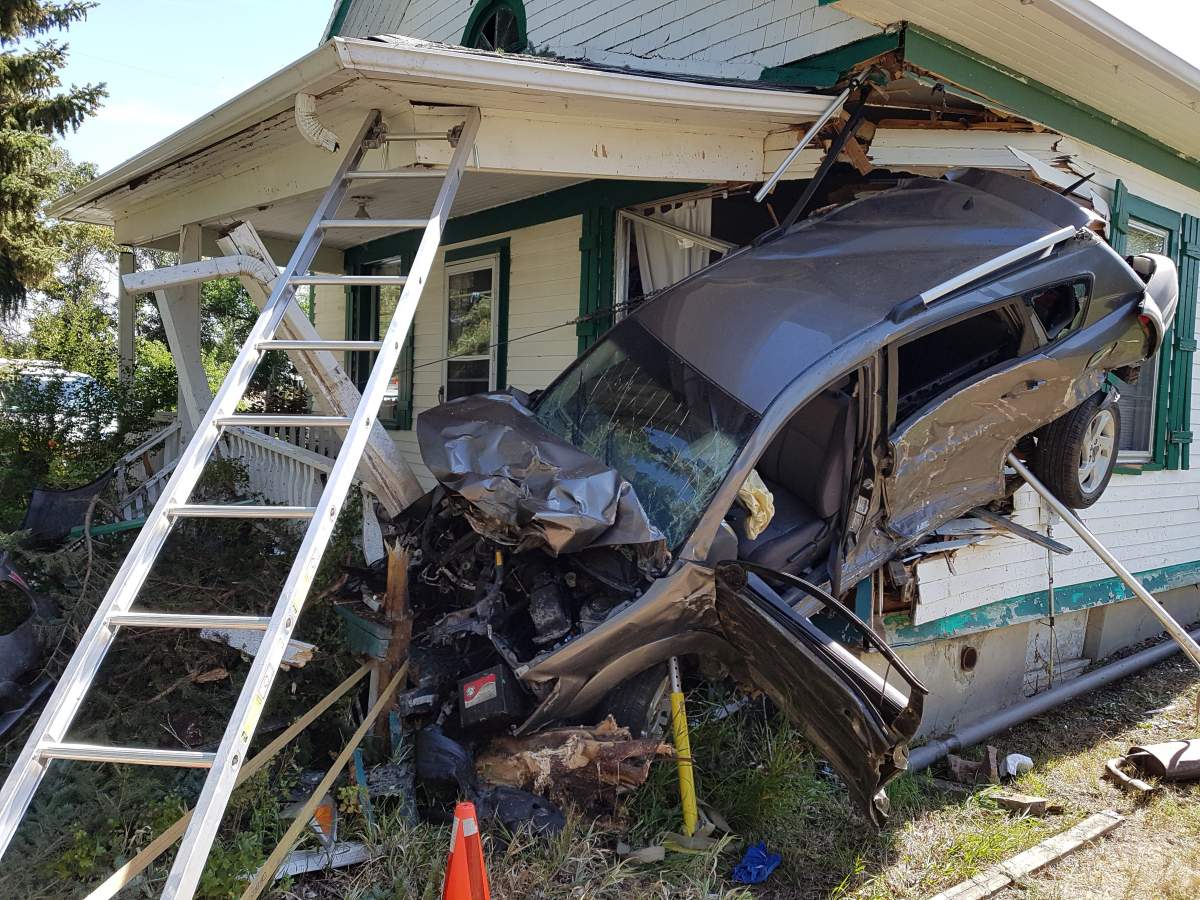A car collided with a house on Highway 512 east of Lethbridge on Thursday.