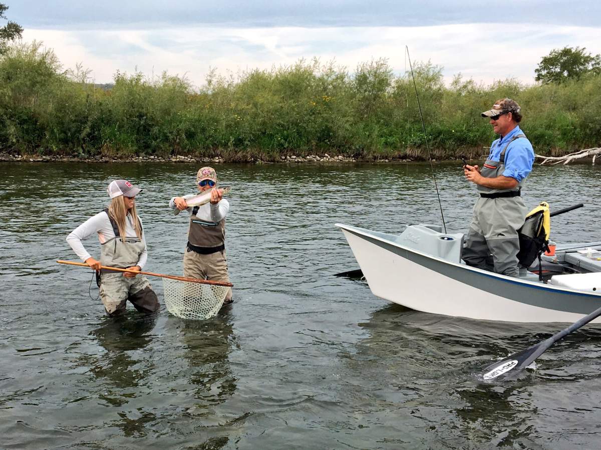 Jenny McCarron showing off the fish she caught Wednesday afternoon while fly-fishing on the Bow River.