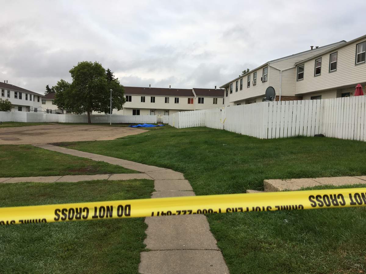Edmonton Police Service officers investigating at the Parkview Estates rental complex, at 116a Avenue and 32 Street, in the Rundle Heights neighbourhood. Monday, August 27, 2018.