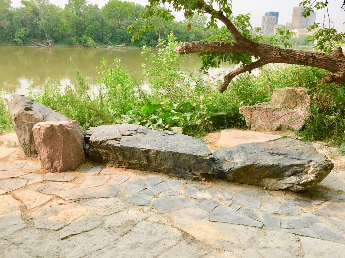 The canoe sculpture faces the East side of the Red River.