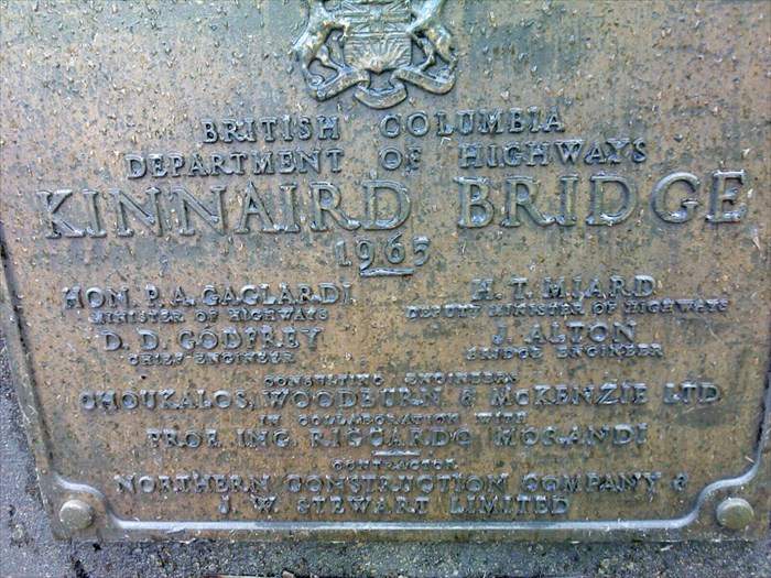 A commemorative plaque is shown on the Kinnaird Bridge in Castlegar, B.C.
